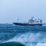 A fishing boat in rough seas off the coast of Norway
