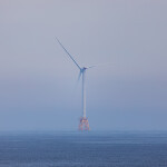 A photo of an offshore wind turbine.