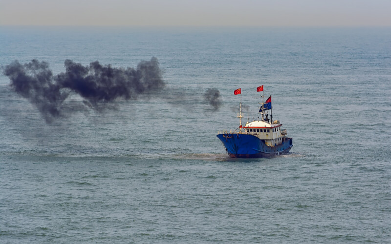 A Chinese fishing trawler spewing out black smoke