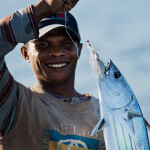 A Maldivian fisher holding a skipjack tuna