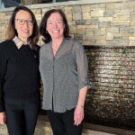 SNP Founder and President Linda Cornish and Vice President of Marketing and Communications Sarah Crowley standing in front of a fountain
