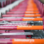 A row of Sainsbury's shopping carts
