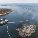 An aerial view of a SalMar salmon farming site