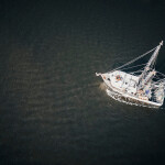 An aerial shot of a lone fishing boat at sea