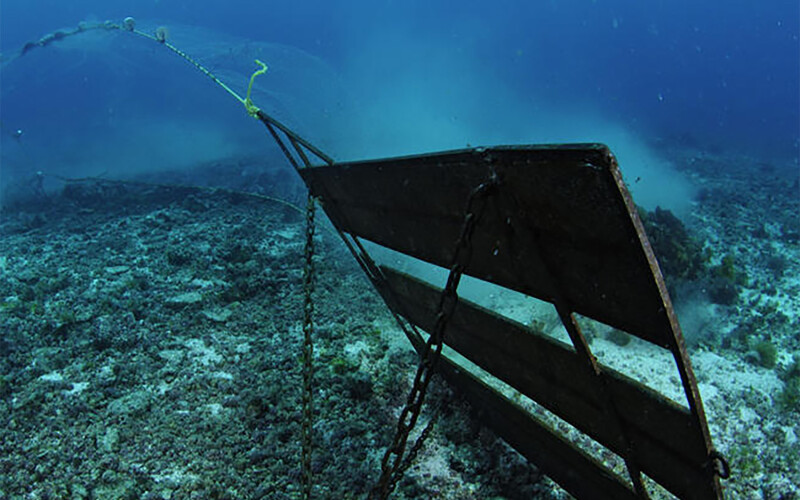 A bottom-trawling net scraping the ocean floor