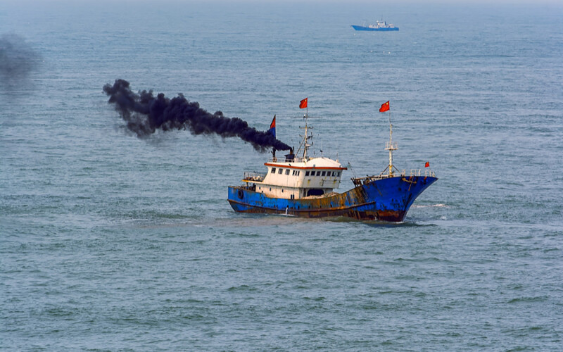 A Chinese fishing boat belching out smoke