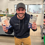 Circle Seafoods Co-Founder Eren Shultz holding two bags of pink salmon