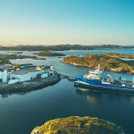 A ship offloading product to a Masoval facility