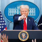 U.S. President Donald Trump pointing at a reporter during a press conference