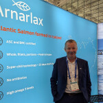 Arnarlax CEO Björn Hembre inside his booth at Seafood Expo North America