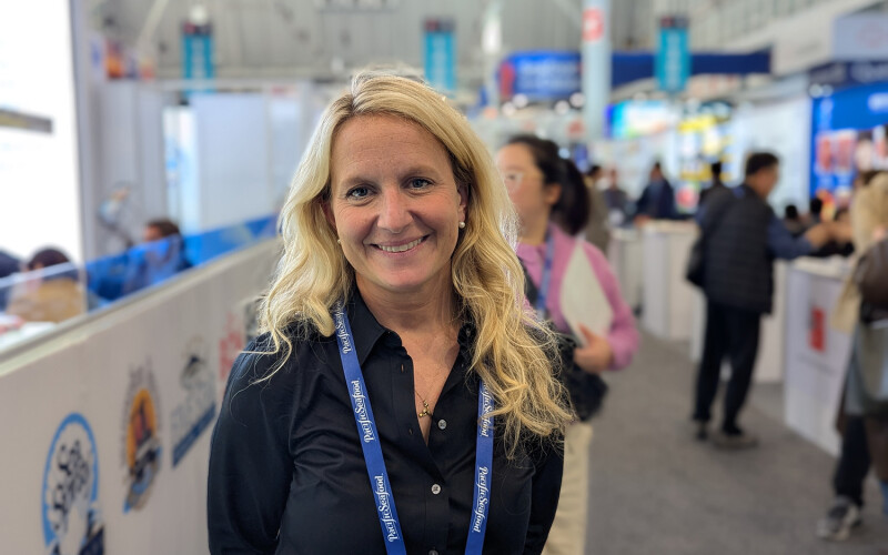 Pine Island Redfish CEO and Co-founder Megan Sorby in an aisle at Seafood Expo North America
