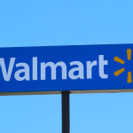 A Walmart sign against a blue sky