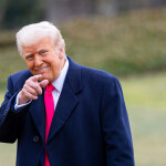 U.S. President Donald Trump smiling and pointing