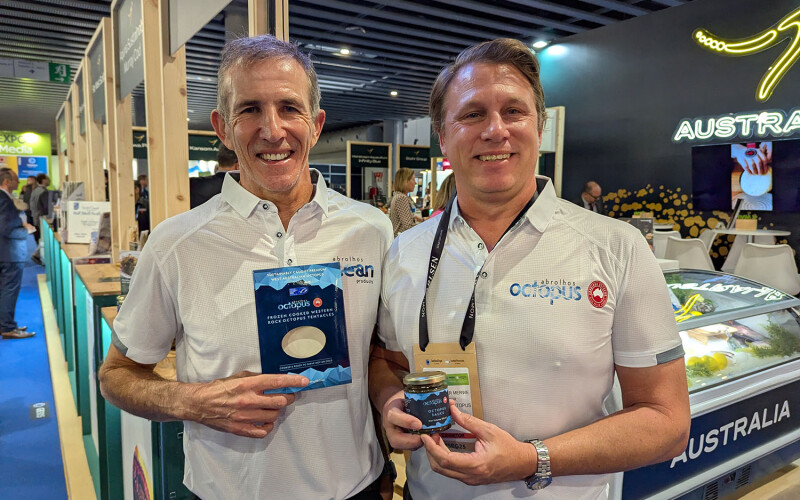 Abrolhos employees at Seafood Expo Global showing off their product packaging
