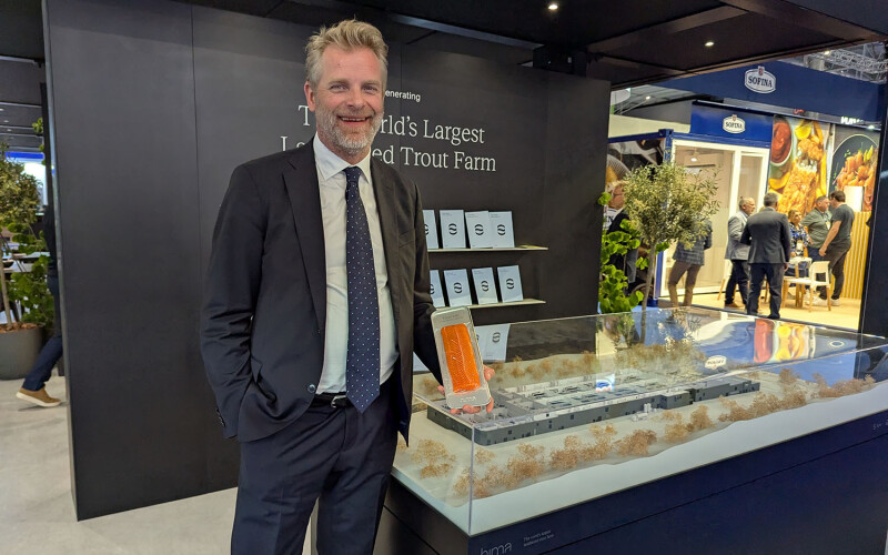 Hima Seafood CEO Sten Falkum showing the company's trout at Seafood Expo Global