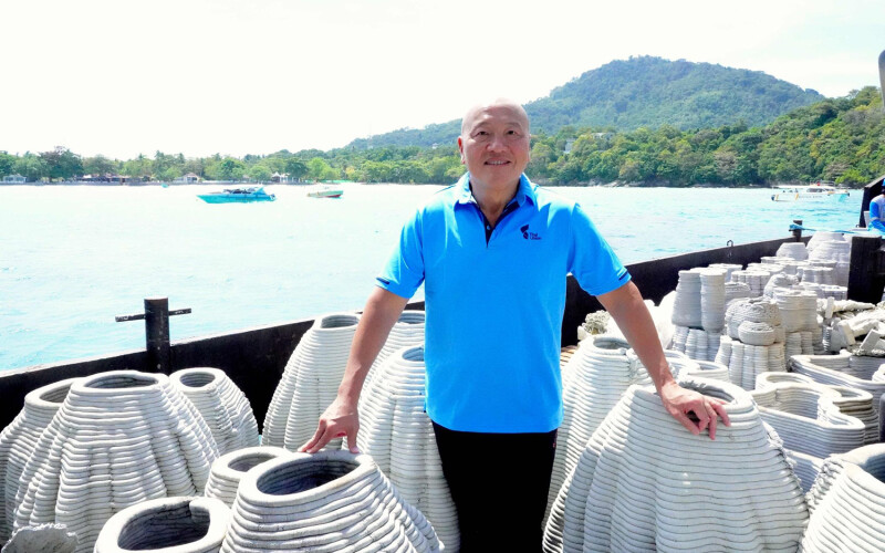 Thai Union CEO Thiraphong Chansiri delivering coral-restoration gear as part of the firm's wide-ranging sustainability initiatives