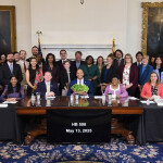 Maryland Governor Wes Moore signing legislation