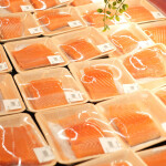 A cool case filled with packaged Atlantic salmon fillets