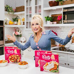 Dolly Parton posing with her new Conagra products
