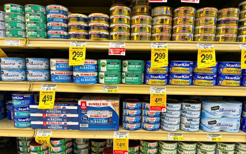 Canned tuna on a grocery store shelf