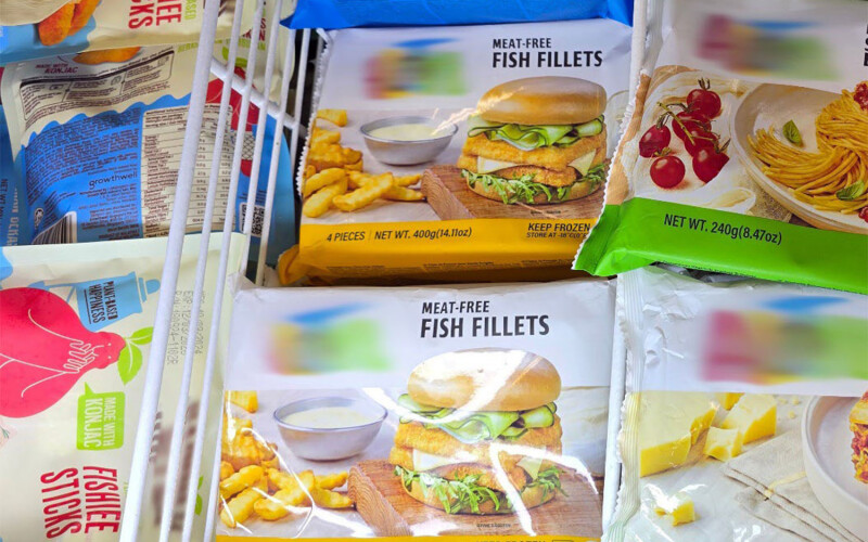 An array of plant-based seafood products inside a display case