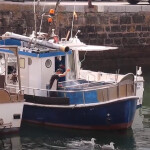 A fisher on a boat in Europe