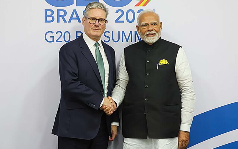 U.K. Prime Minister Keir Starmer and India Prime Minister Narendra Modi shaking hands