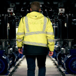A Salmon Evolution employee walking through the company's facility