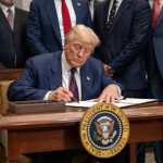 U.S. President Donald Trump signing an executive order