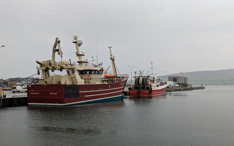 A pair of fishing boats in the town of Dingle, Ireland