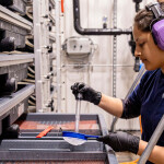 An Atlantic Sapphire employee caring for the company's salmon eggs