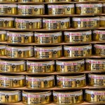 A large stack of golden Bumble Bee Foods tuna cns