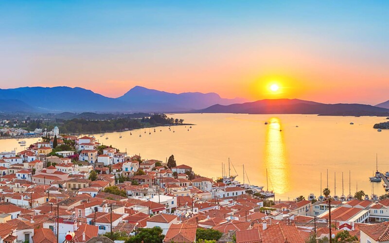Sunset over the island of Poros in Greece