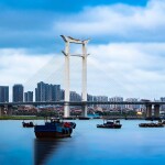 The Jinjiang Bridge in Quanzhou, China, with boats in the foreground