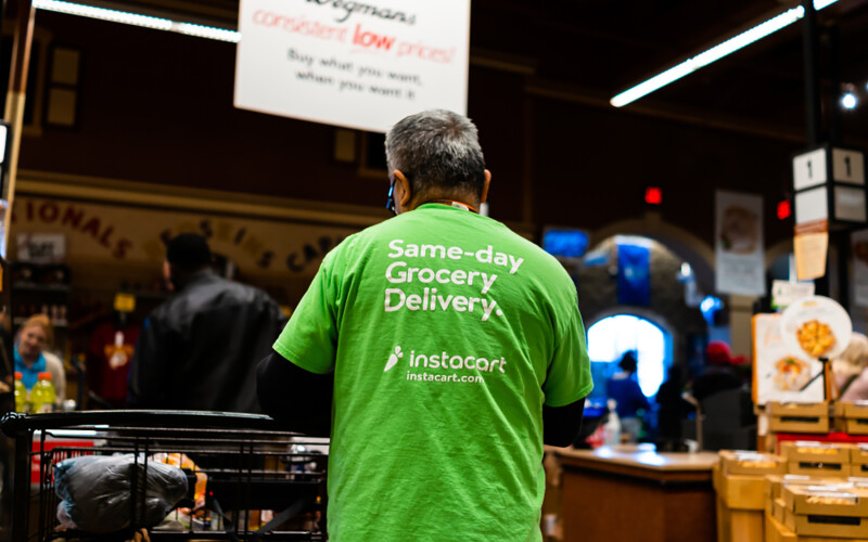 An Instacart shopper at a grocery store