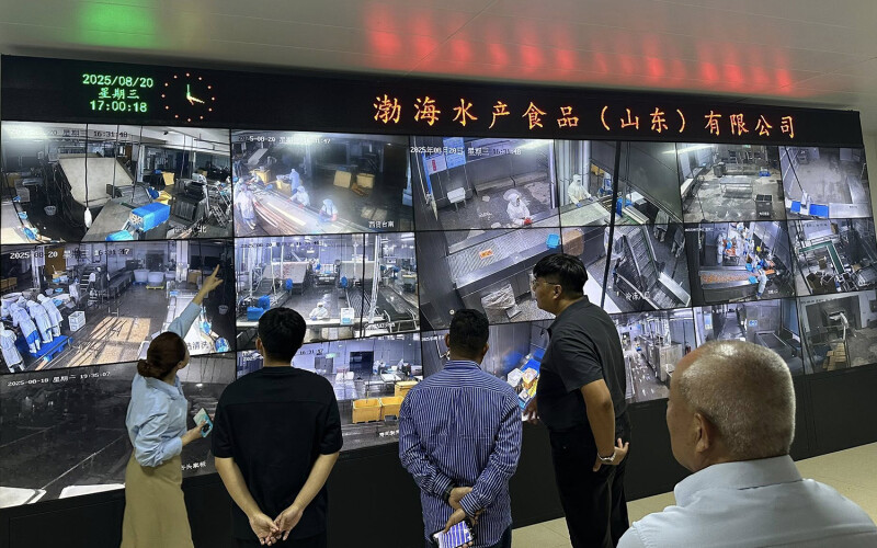 Heifer employees being shown surveillance of the Bohai Aquatic Foods shrimp-farming and -processing operation in Shandong Province