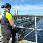 A Gigante Salmon worker looking at one of the company's salmon tanks