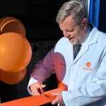 Finlay Carson cutting a ribbon