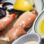 Stone crab claws on a plate with butter