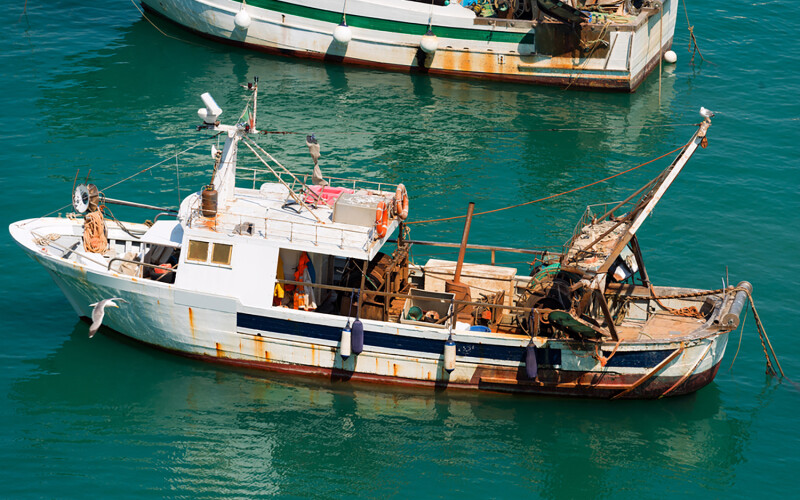 A small trawling vessel off the coast of Liguria, Italy