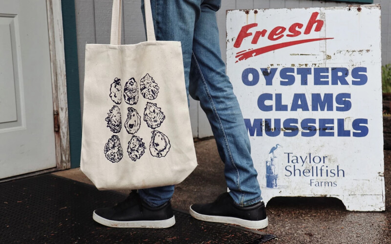 The exterior of a seafood market offering Taylor Shellfish oysters, clams, and mussels
