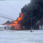 An early photo of the fire at the Aquashell processing facility
