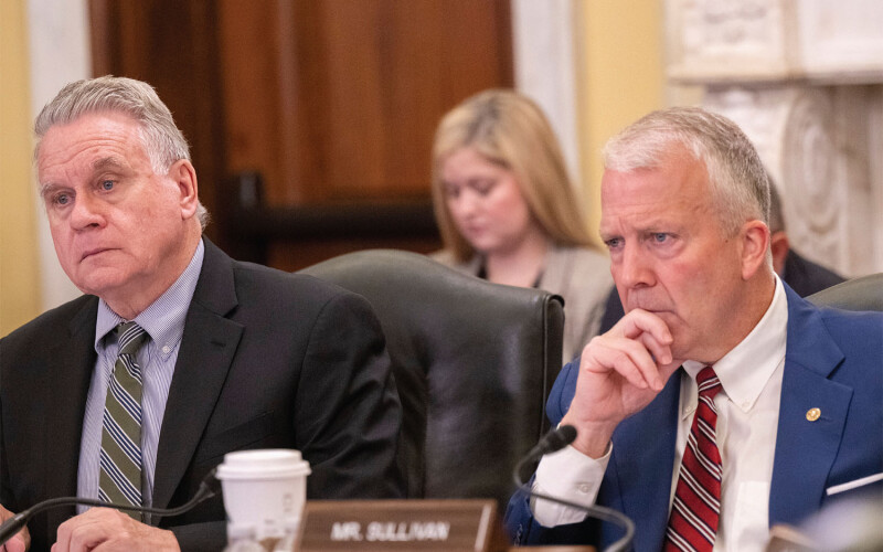 Representative Christopher Smith (R-New Jersey) and Senator Dan Sullivan (R-Alaska) at a CECC hearing