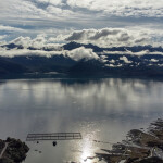 An aerial shot of salmon net pens in Chile