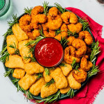 A wreath with shrimp and nuggets lining it