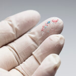 Microplastics on a gloved hand