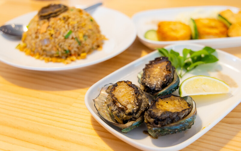 Abalone served on a dish at a restaurant