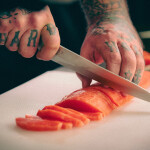 A chef cutting Caleta Bay trout