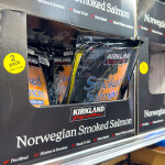 Kirkland branded Norwegian smoked salmon on shelves.