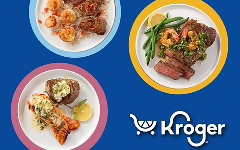 Plates with steak, lobster, and crab on them